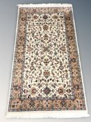 A Tabriz rug, 172 cm x 91 cm.