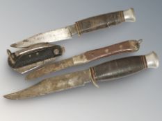 A group of hunting / folding knives, largest 26 cm long.