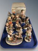 A collection of Hummel figures.