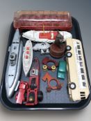 A group of plastic scale models including buses, submarine, etc.