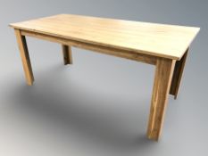 A contemporary pine rectangular dining table, 180 cm x 86 cm x 78 cm.