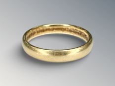 An 18ct gold band ring, size P½ CONDITION REPORT: 4.