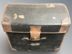 An early 20th century leather dome top trunk, width 67 cm.