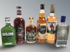 Six various bottles of alcohol including Captain Morgan, Hotspur gin, Gordons gin, etc.