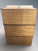 Three stackable teak fall front wall cabinets,