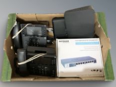 Two office telephone handsets, ethernet switch in box, etc.