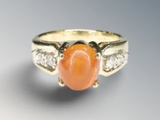 An 18ct yellow gold fire opal and diamond ring. CONDITION REPORT: 6.4g.