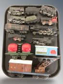 A group of vintage tin plate locomotives and rolling stock.