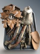 A reproduction carved beech cuckoo clock, replica flintlock and percussion cap pistols,