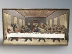 A cast and painted metal panel depicting The Last Supper,