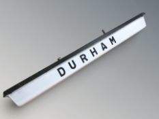 An illuminated plastic railway sign 'Durham', width 170 cm.