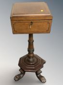 A mahogany and satin wood pedestal teapoy,