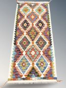 A Chobi Kilim runner, 152 cm x 67 cm.
