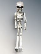 An articulated wooden skeleton, height 60 cm.