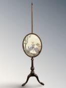 A mahogany tapestry pole screen.