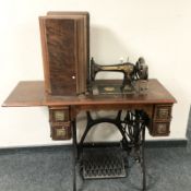 A Singer treadle sewing machine.
