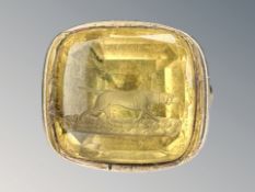 An early 19th century seal fob with carved yellow stone intaglio of a hound CONDITION