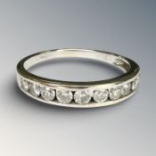 An 18ct white gold diamond half eternity ring, set with ten round cut diamonds approximately 0.