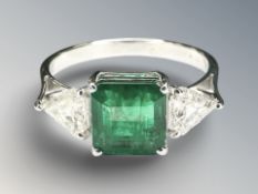 A good quality emerald and diamond ring in 18ct white gold,