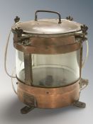A circular glazed copper ship's masthead light, wired for electricity, height 33 cm.