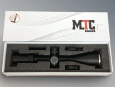 An MTC Optics King Cobra 4-16X50F1 telescopic rifle sight, in original box with two lens covers.