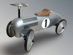 A small pushalong racing car, length 77 cm.