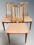 A set of three G Plan teak dining chairs.