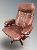 A Scandinavian stained bentwood Burgundy leather lounge chair,