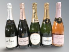 Five modern bottles of champagne including Abel Charlot, Laurent-Perrier, Monsigny, plus two others.