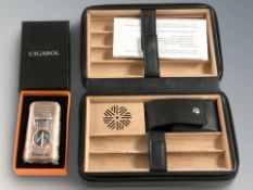 A Cigarol table top cigar humidor and a boxed combination lighter / cutter.