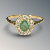 An 18ct gold emerald cluster ring,