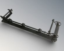 A reproduction wrought metal fire curb.