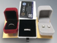 A group of silver and moissanite jewellery including five stone ring, a half eternity ring,