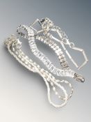 Three silver bracelets.