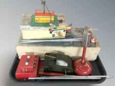 A group of tin plate models, wind-up tank, remote control helicopter in box, etc.