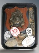 A group of brass and other metal plaques.