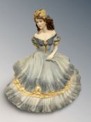 A Coalport matt-glazed china figure : Age of Elegance - Secret Rendezvous, height 22 cm.