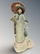 A Coalport matt-glazed china figure : Age of Elegance - Brighton Promenade, height 23 cm.
