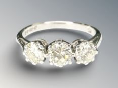 An 18ct gold three stone diamond ring, the total diamond weight estimated at 0.