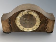 An Art Deco oak mantel clock, width 39 cm, with key, no pendulum.