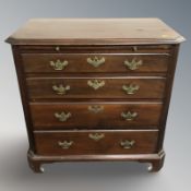 A George III style mahogany four drawer bachelor's chest with brushing slide,