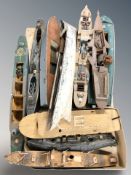 A group of partially built model boat hulls.