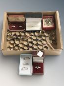 Three silver dress rings, a further silver ring set with faceted green stone,