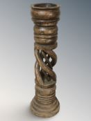 A large turned wooden pricket candlestick, height 69 cm.