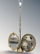 Three reproduction gilt framed mirrors and a brass standard lamp.