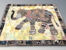 A large Indian embroidered throw with bead work decoration depicting an elephant,