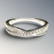 An 18ct white gold diamond ring set with round and square cut diamonds, approximately 0.