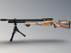 A Reximex .177 caliber PCP multi shot air rifle, with two magazines and a collapsible tripod.