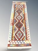 A Chobi Kilim runner, 198 cm x 62 cm.