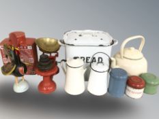 An enameled bread bin and other similar enameled wares, scales with weights, etc.
